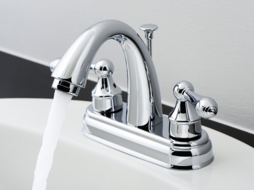 Running water from a clean bathroom faucet in Tucson