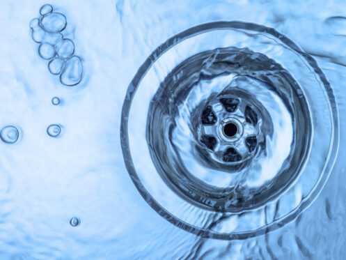 A kitchen sink draining freely.