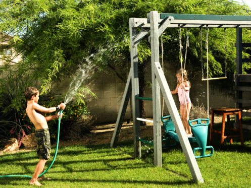 Brother and sister playing in their Tucson backyard